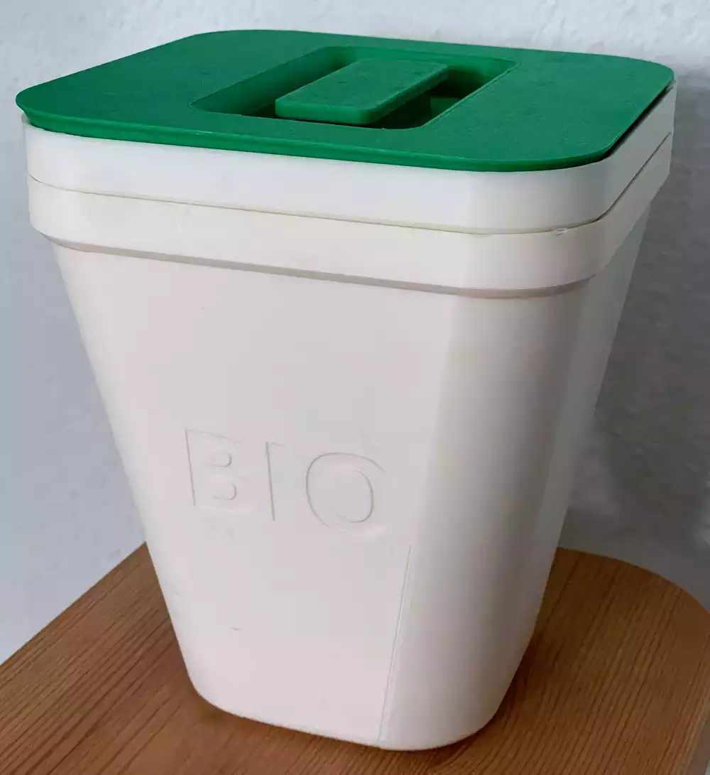 Photo of finished, nested bins in white with green lid.