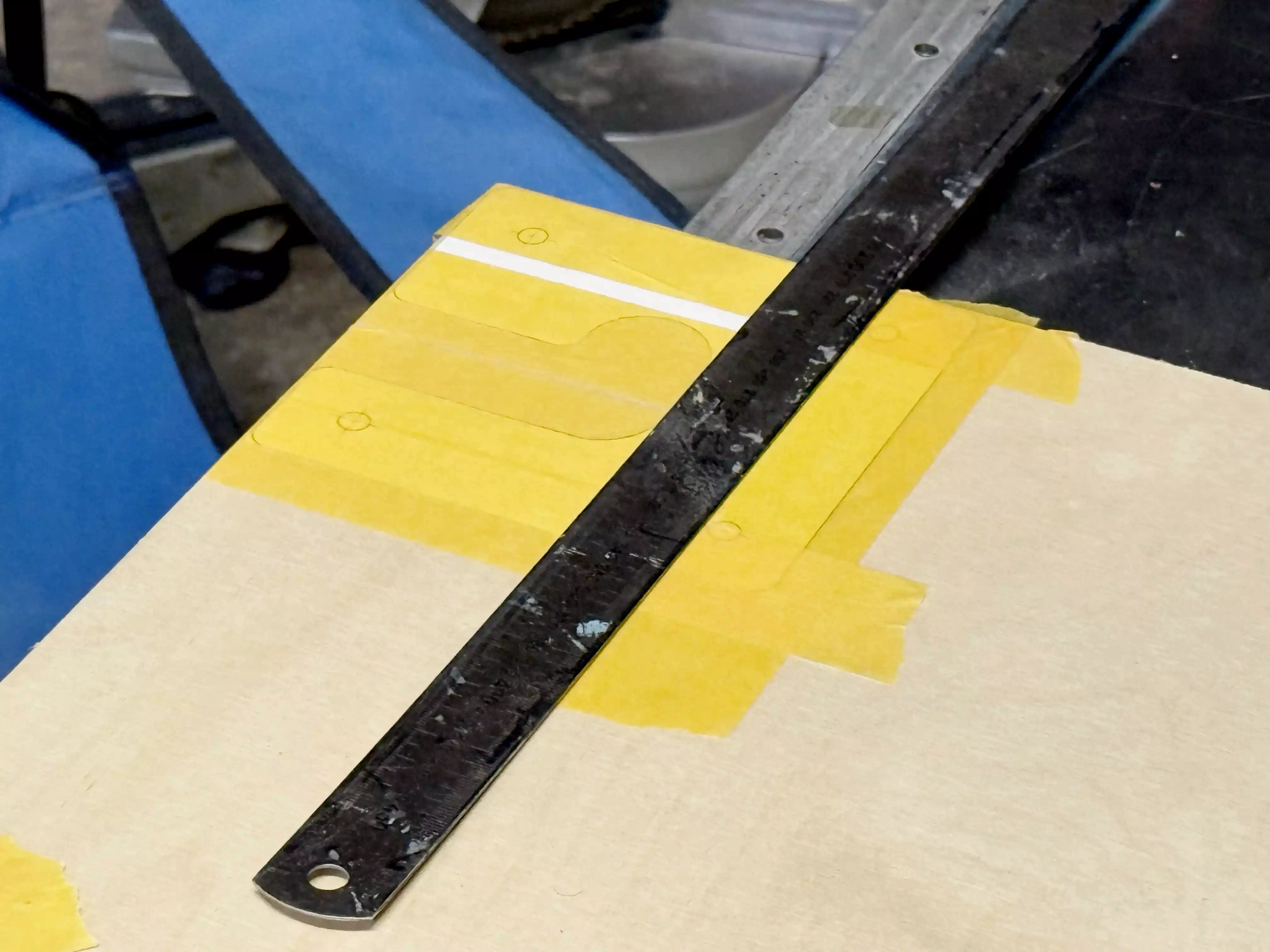 Template taped onto plywood.