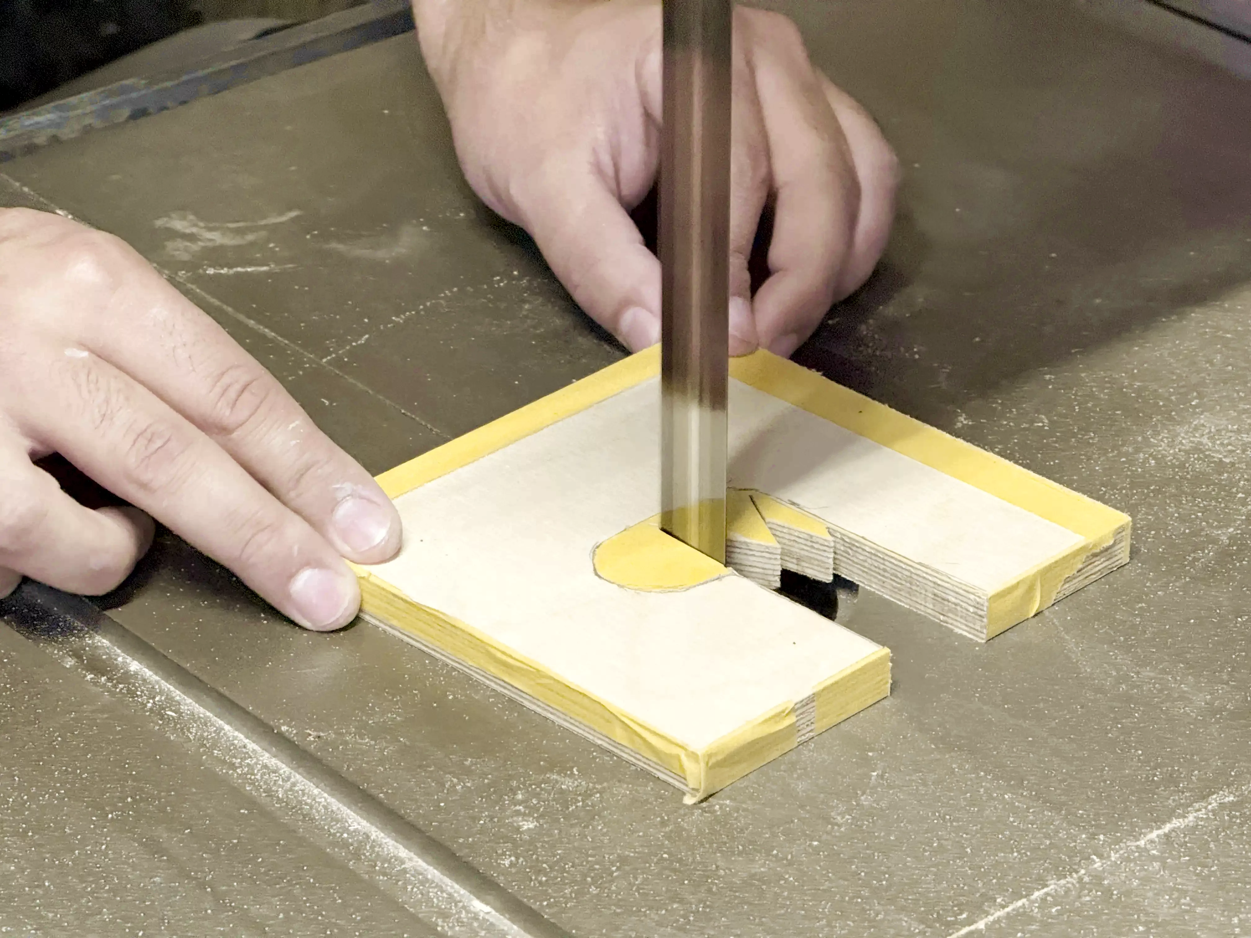 Cutting on a band saw.